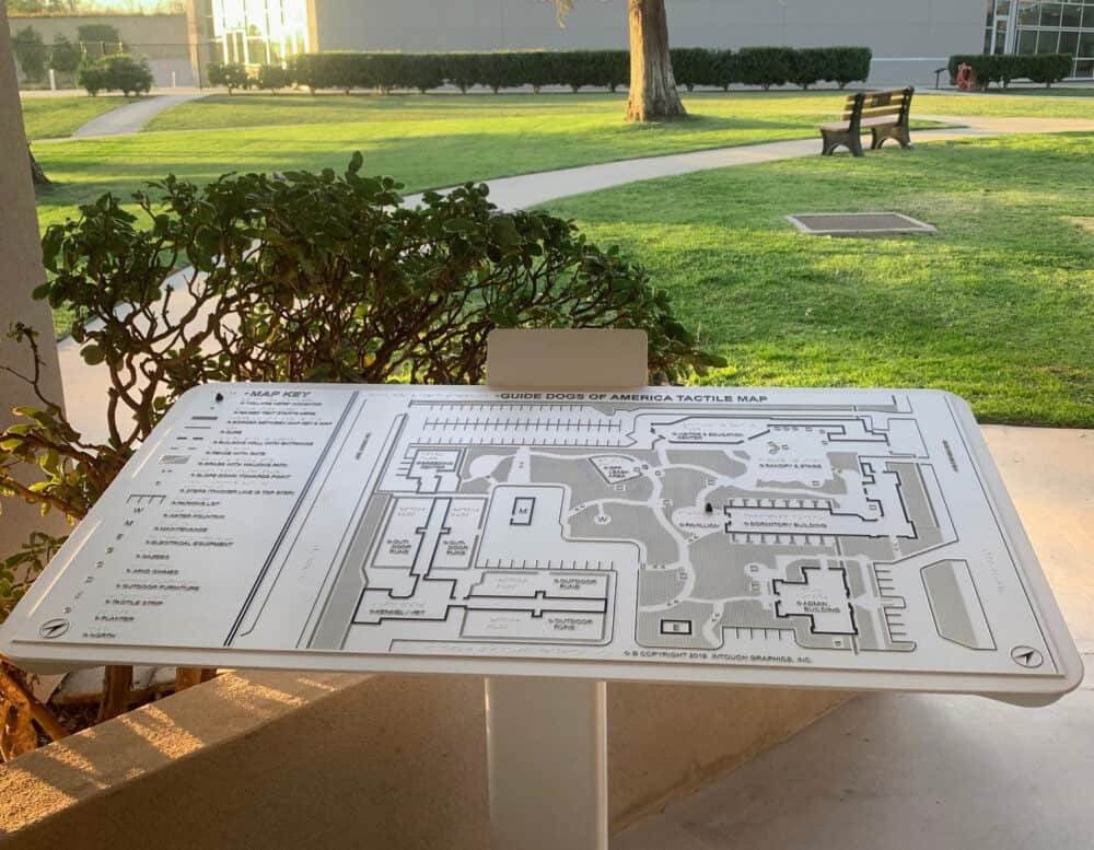 Tactile map mounted on outdoor post, Guide Dogs of America campus